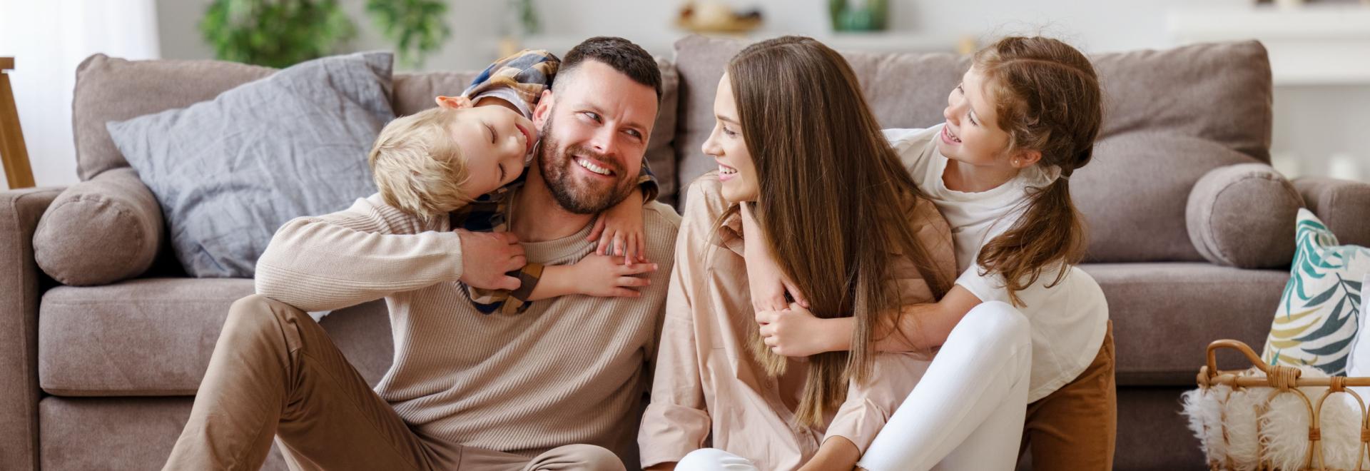 Happy Family Smiling in their home.