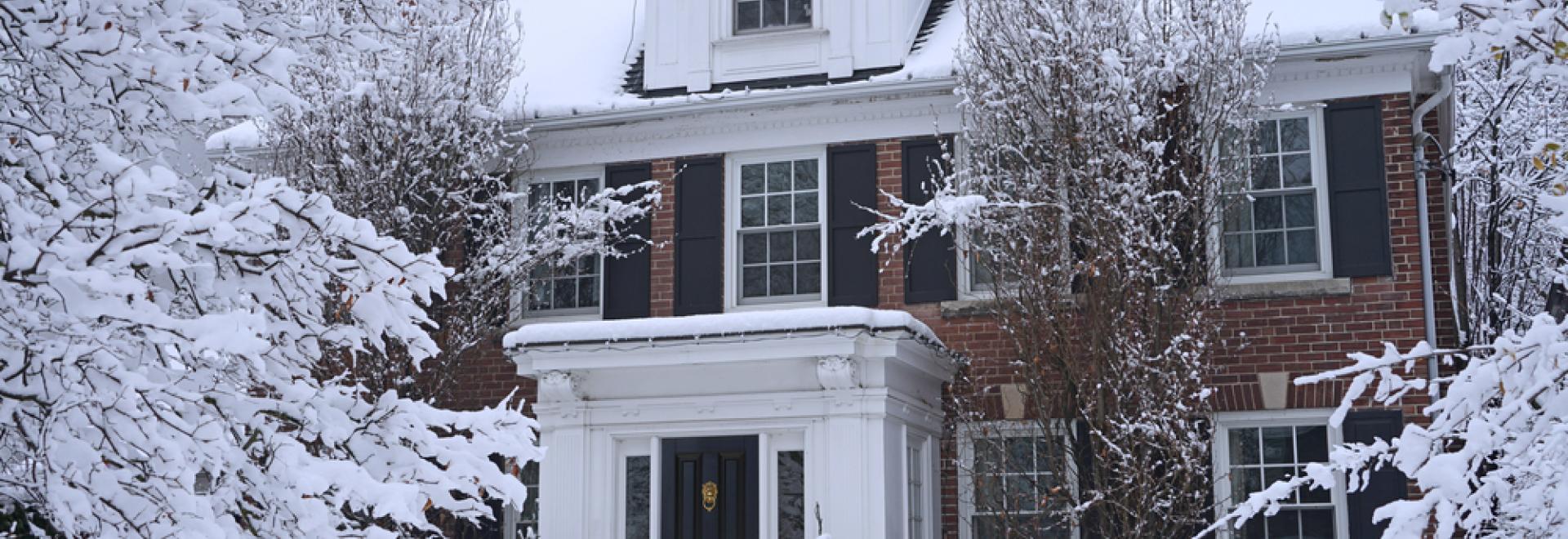 Home covered in snow during winter